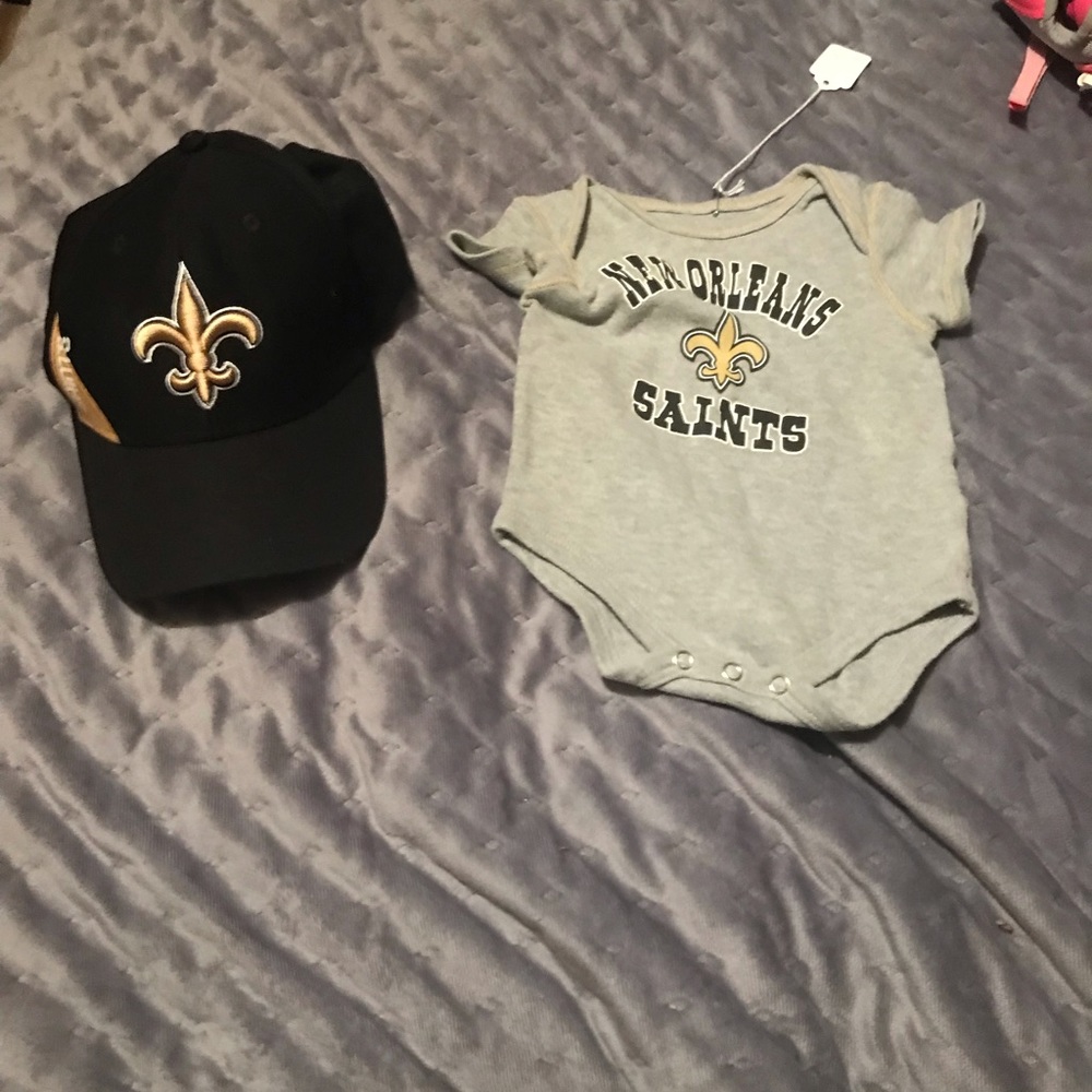 A  Saints onesie and a saints hat